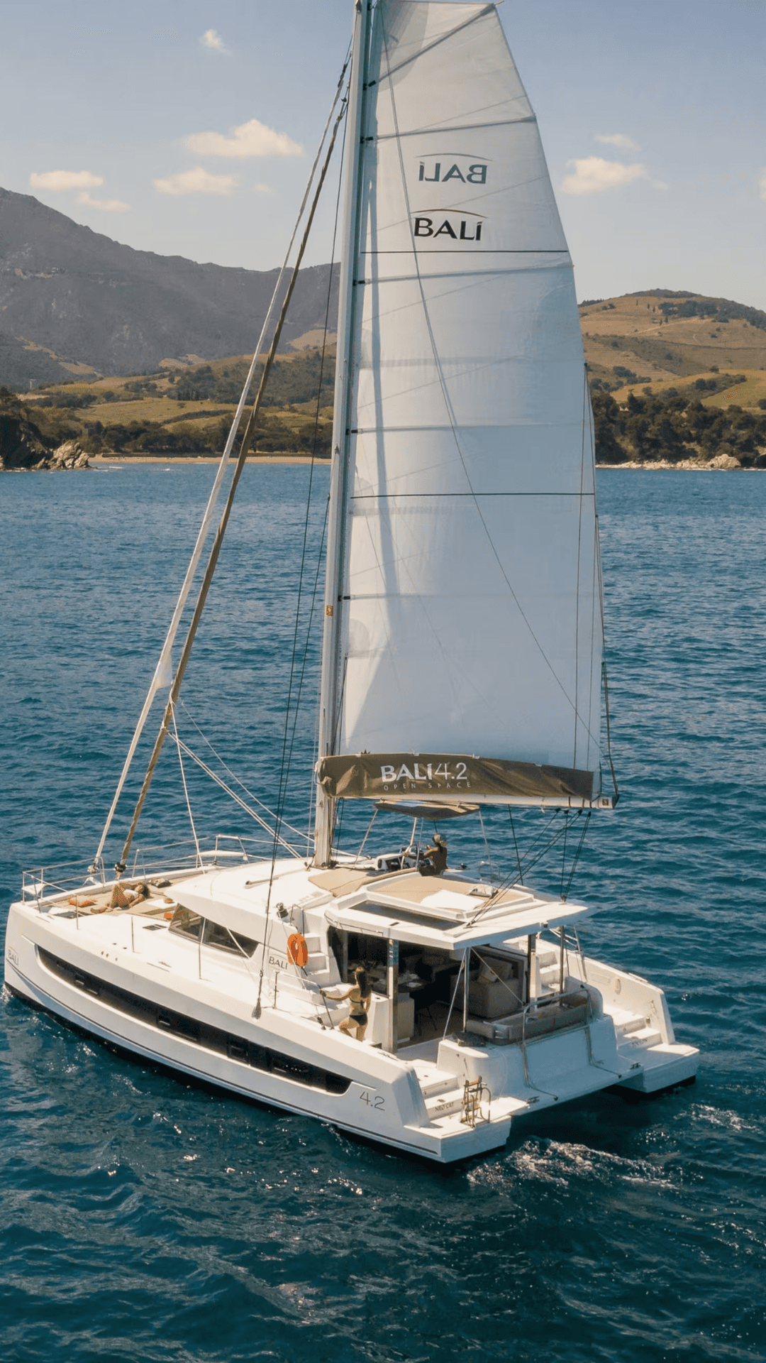 Luxury yacht docked at marina during sunset